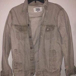 A beige jean jacket